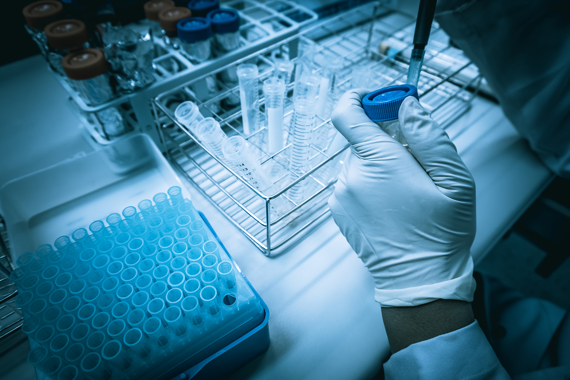 scientist-mix-chemicals-with-shake-machine-before-experimentmixture-laced-with-samples-into-test-tubesthailand-scientist-working-lab